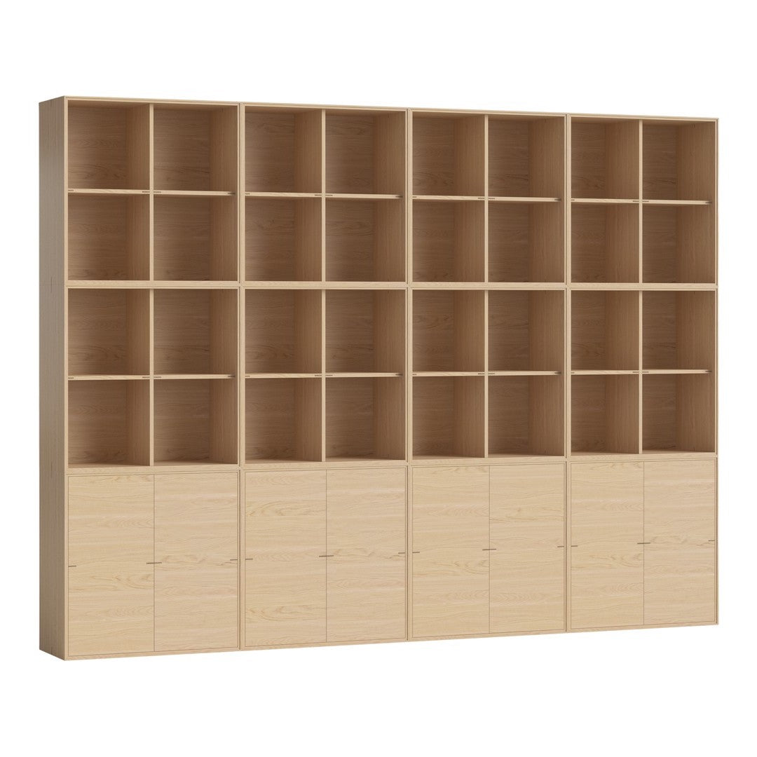 Light wood bookshelf with natural grain, featuring a minimalist design and multiple open and closed storage compartments.