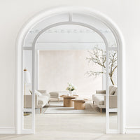 Arched white frame with neutral-toned walls and soft beige furniture, showcasing a minimalist, modern interior.
