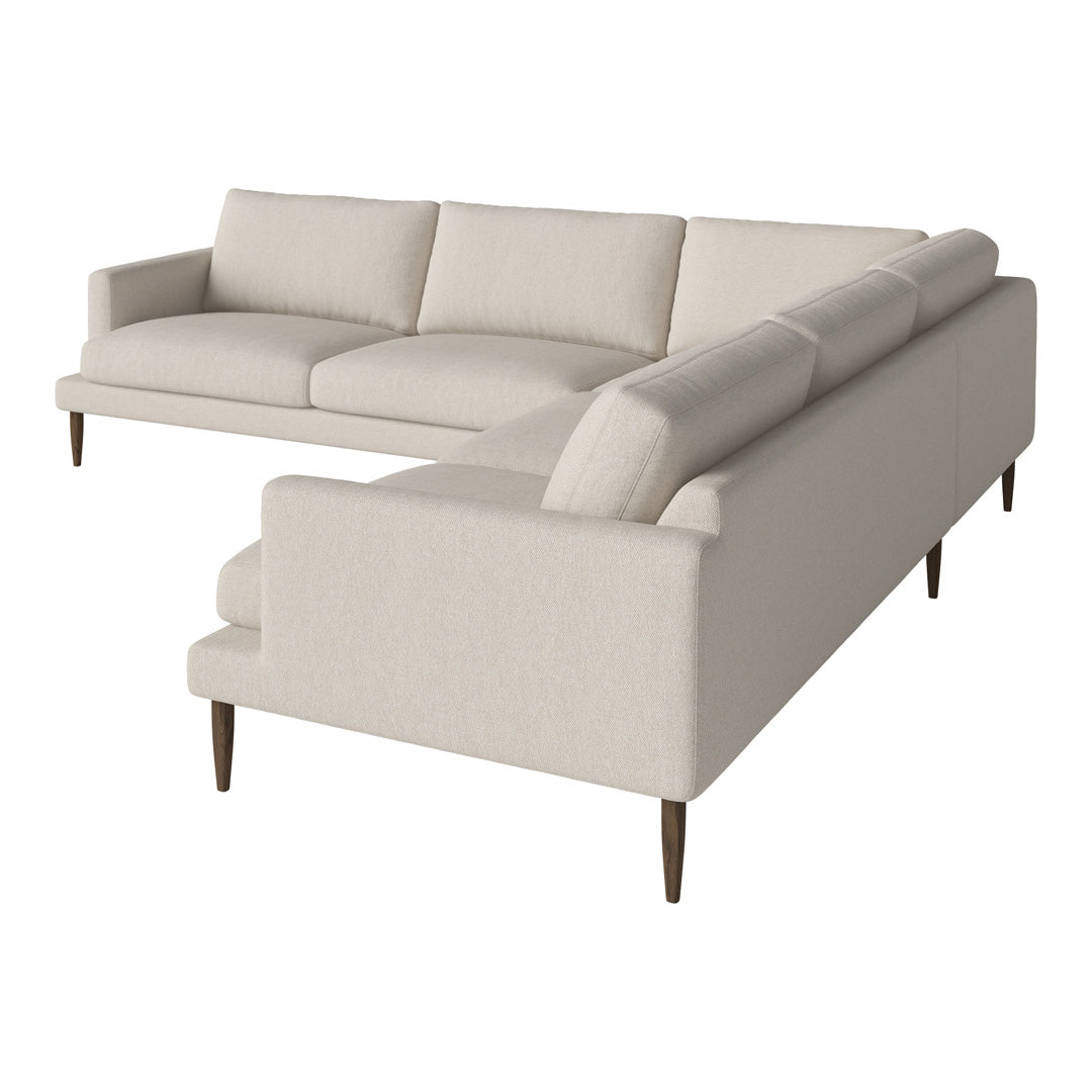 Light beige modular sectional sofa with clean lines and tapered wooden legs, featuring a simple, textured fabric.
