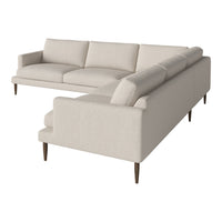Light beige modular sectional sofa with clean lines and tapered wooden legs, featuring a simple, textured fabric.
