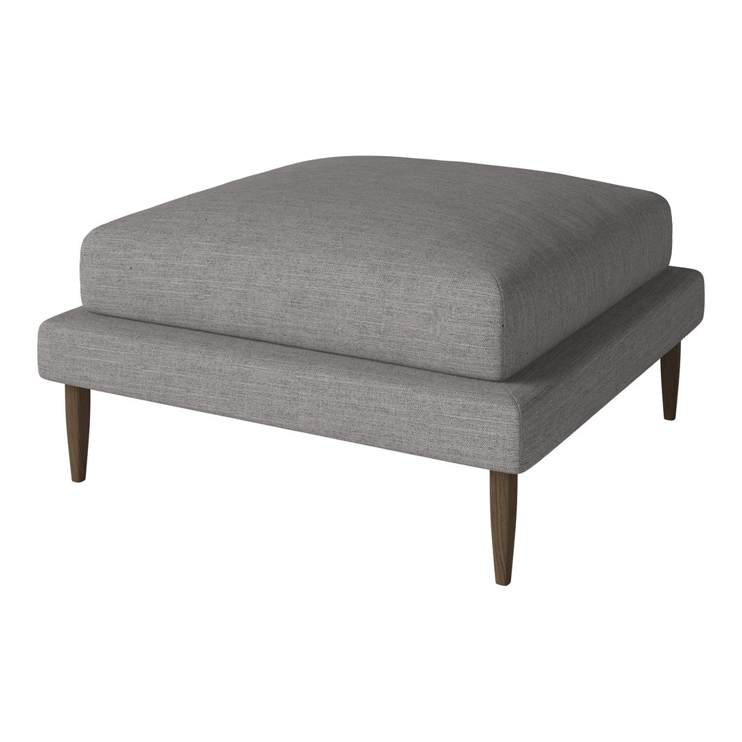 Gray upholstered ottoman with a smooth texture and tapered wooden legs, ideal for modern decor.