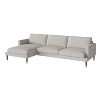 Light gray sectional sofa with clean lines and minimalistic design, featuring soft, textured fabric upholstery.