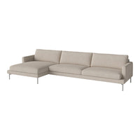 Light beige sectional sofa with a smooth, minimalist design and plush cushions, featuring sleek metal legs.