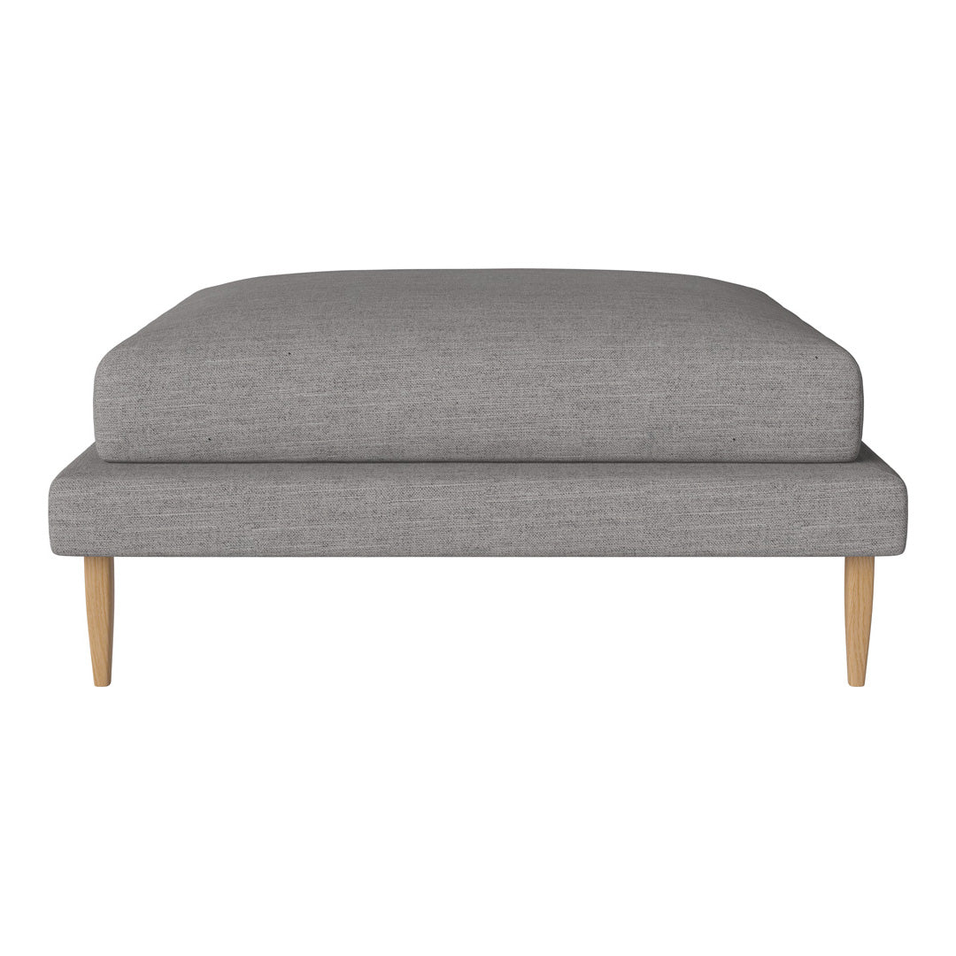 Gray upholstered ottoman with a smooth, minimalist design and natural wood legs. Perfect for modern decor.