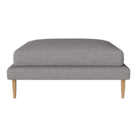 Gray upholstered ottoman with a smooth, minimalist design and natural wood legs. Perfect for modern decor.