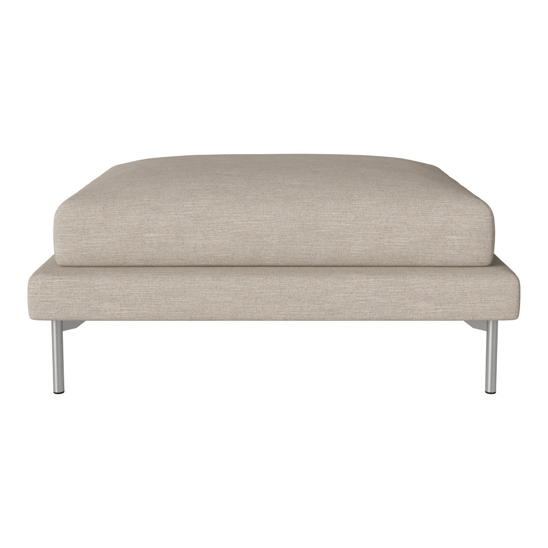 Beige upholstered ottoman with a smooth texture and sleek metal legs, perfect for modern decor.