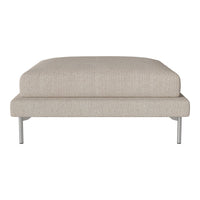Beige fabric ottoman with a smooth texture and minimalist design, supported by sleek silver legs.