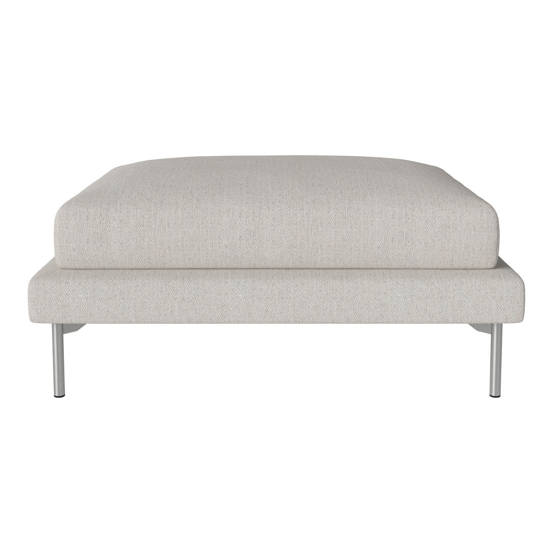 Light gray upholstered ottoman with a smooth texture and minimalistic design, featuring sleek silver legs.