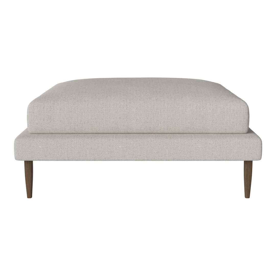Light gray upholstered ottoman with clean lines and wooden legs, featuring a minimalist design. Ideal for modern spaces.