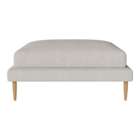 Light beige upholstered ottoman with a smooth texture and natural wooden legs, perfect for modern interiors.