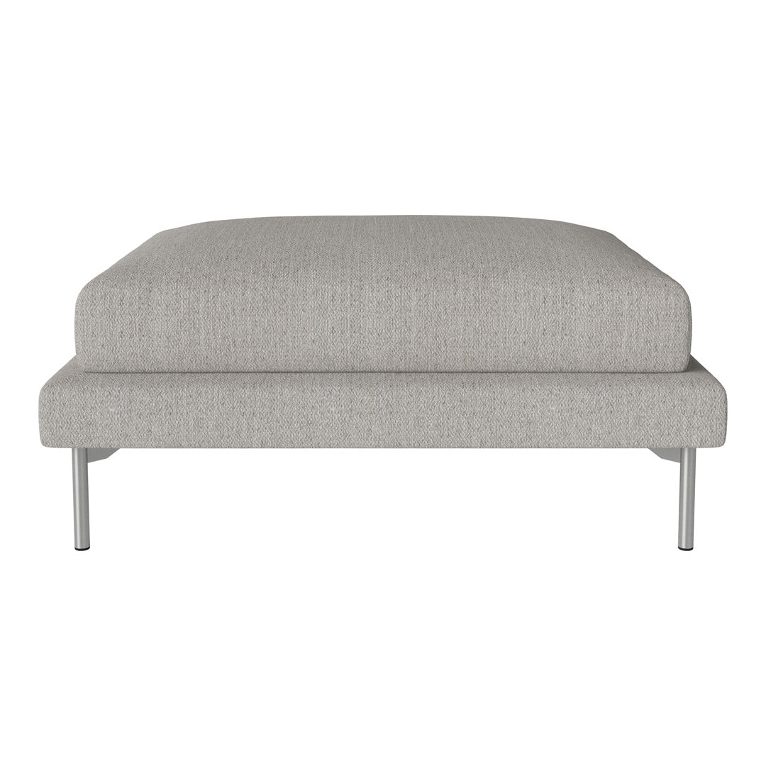 Light gray upholstered ottoman with a smooth, textured pattern and sleek silver legs. Minimalist design for any space.