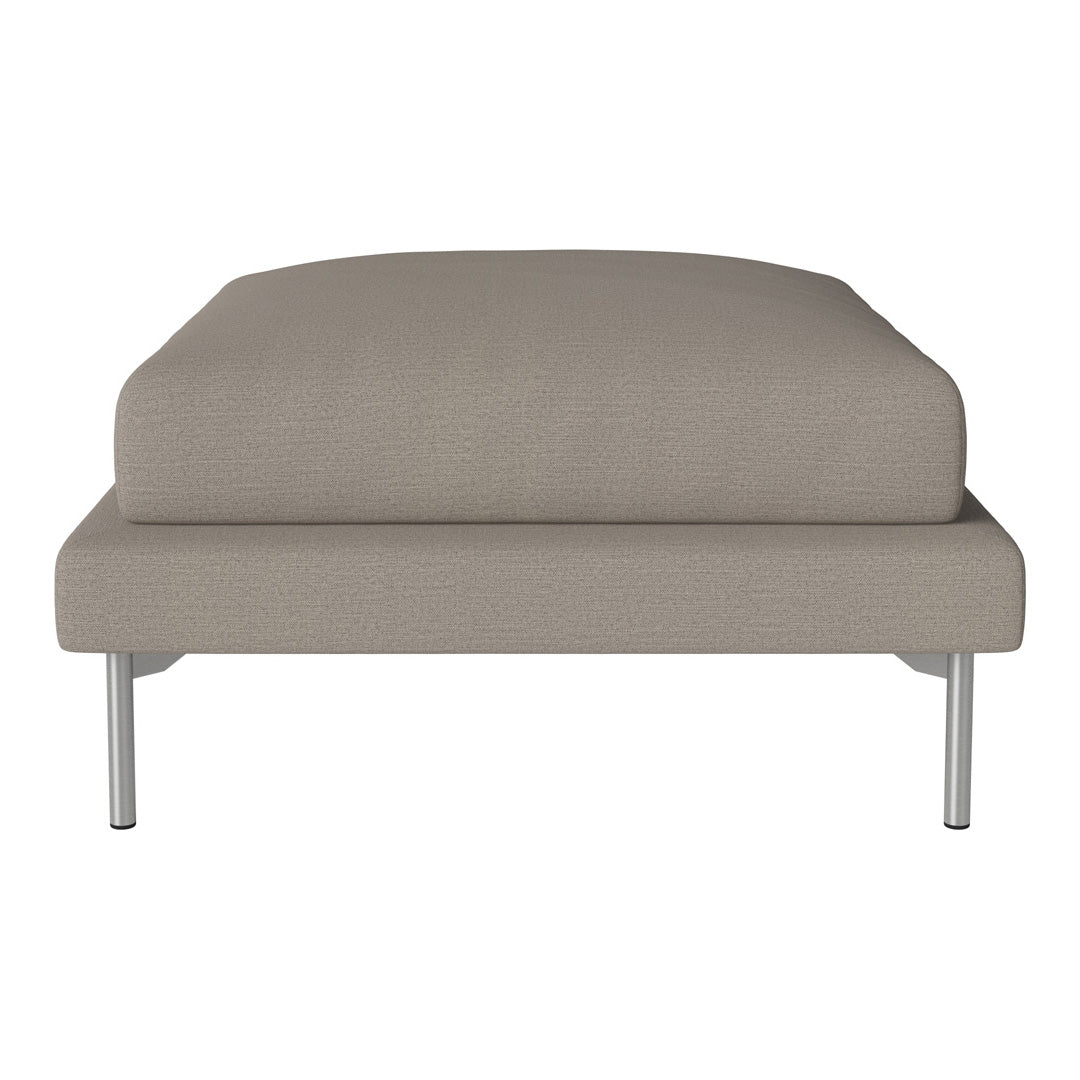 Beige upholstered ottoman with a smooth texture and minimalist design, featuring sleek metal legs.