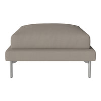 Beige upholstered ottoman with a smooth texture and minimalist design, featuring sleek metal legs.