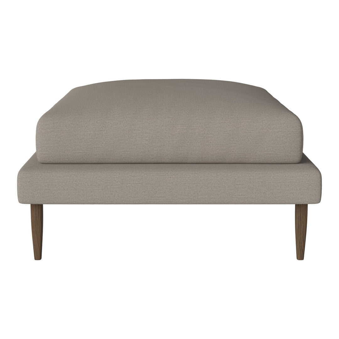 Beige upholstery with a smooth texture, featuring a minimalist design and contrasting wooden legs. Perfect for modern decor.