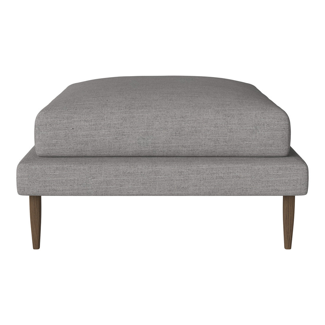Light gray upholstered ottoman with a smooth texture and natural wood legs. Simple, modern design for versatile decor.