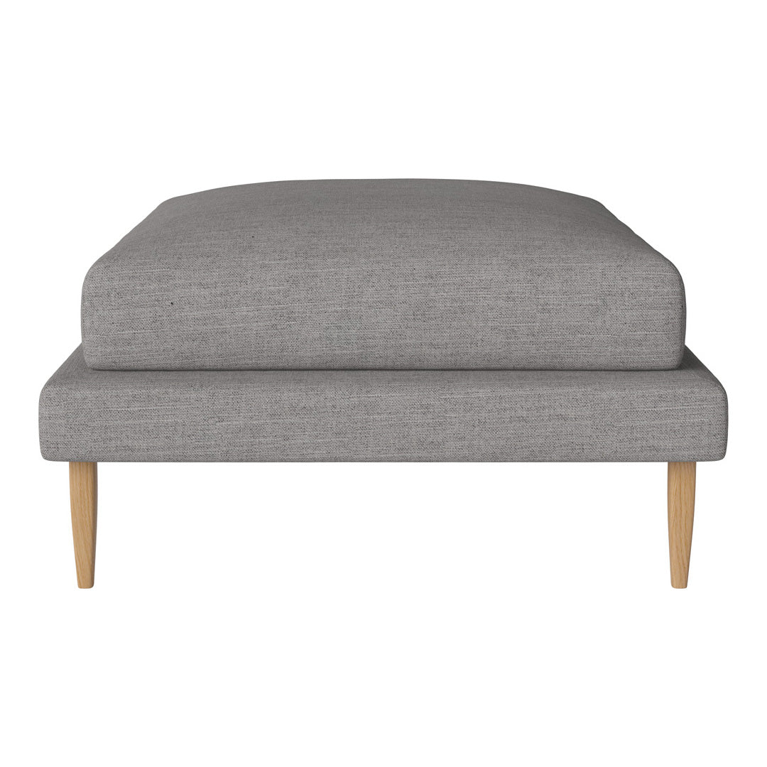Gray upholstered ottoman with a smooth finish and natural wooden legs, perfect for modern decor.