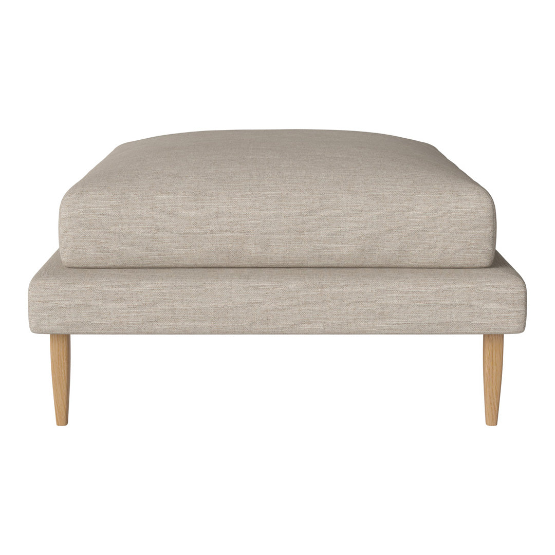 Beige linen ottoman with a smooth finish and light wooden legs. Simple, modern design perfect for any decor.