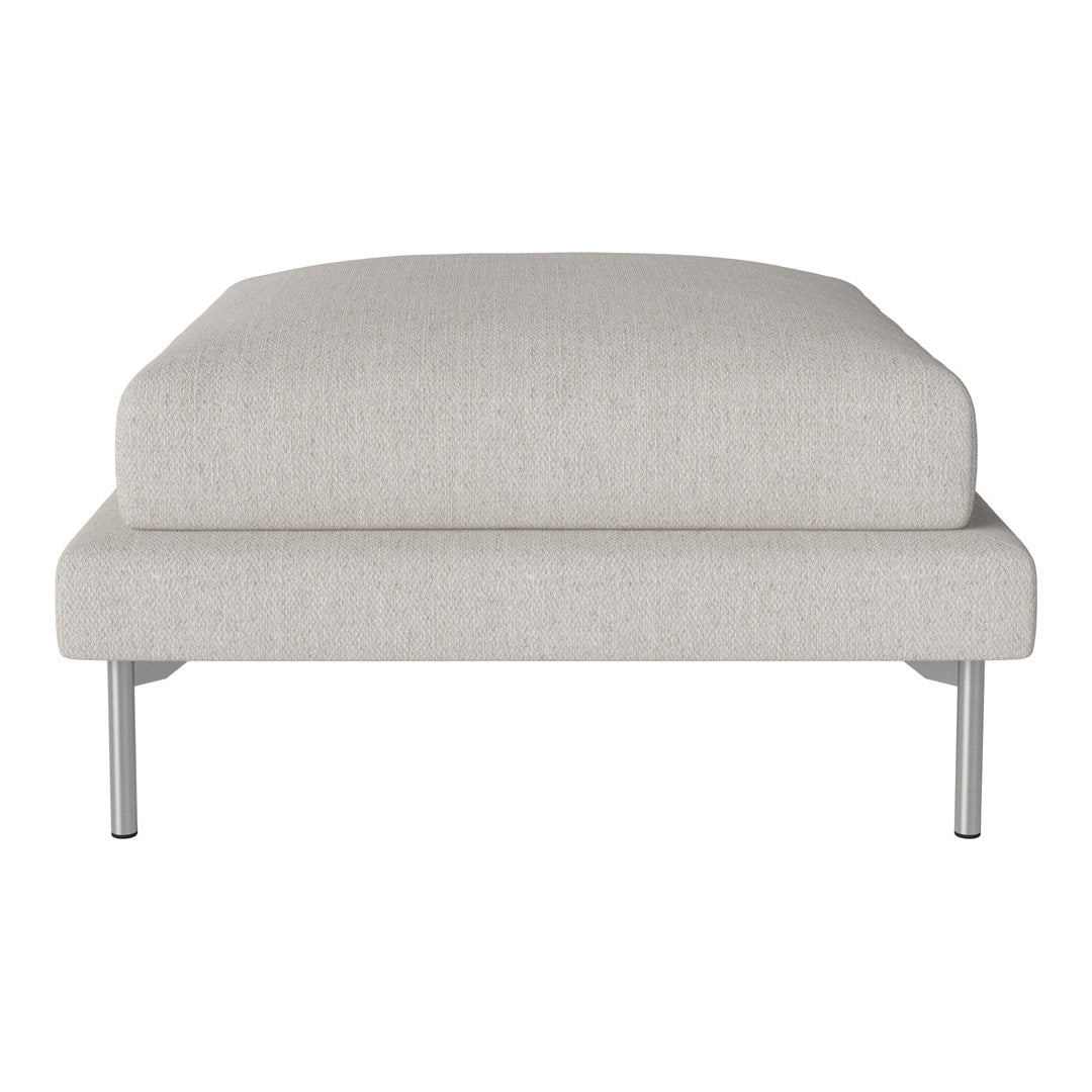 Light gray upholstered ottoman with a smooth texture and minimalist design, featuring sleek silver legs.