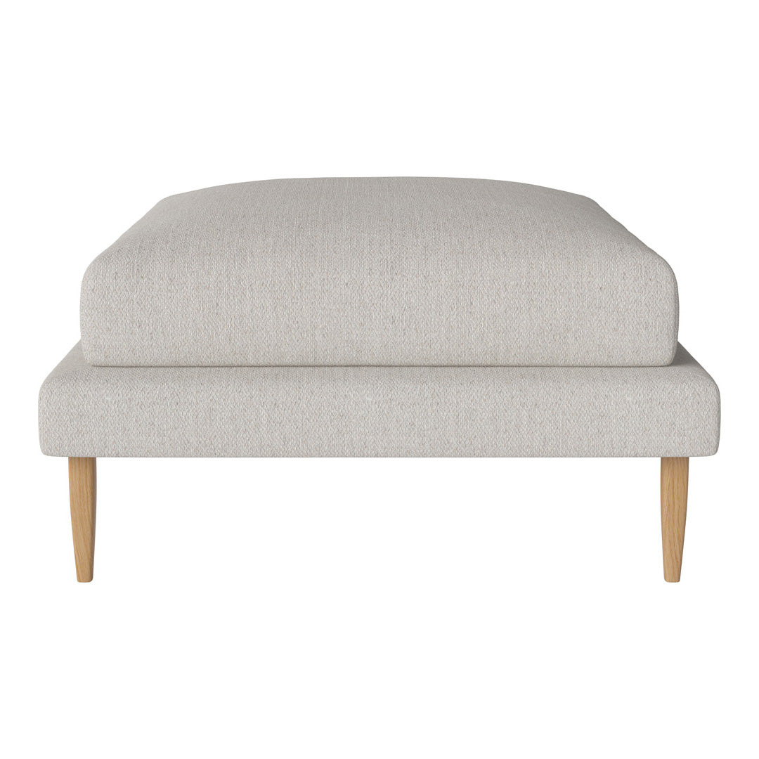 Light gray upholstered ottoman with minimalist design and natural wood legs. Perfect for modern decor.