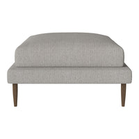 Light gray upholstered ottoman with a smooth texture and minimalist design, featuring wooden legs in a natural finish.