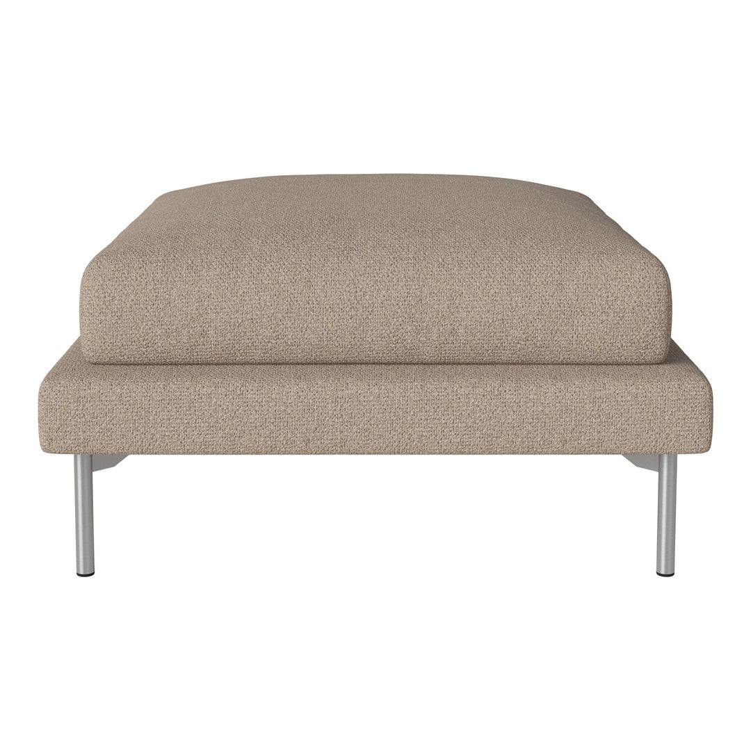 Beige upholstered ottoman with a smooth, minimalist design and sleek silver legs. Perfect for modern decor.
