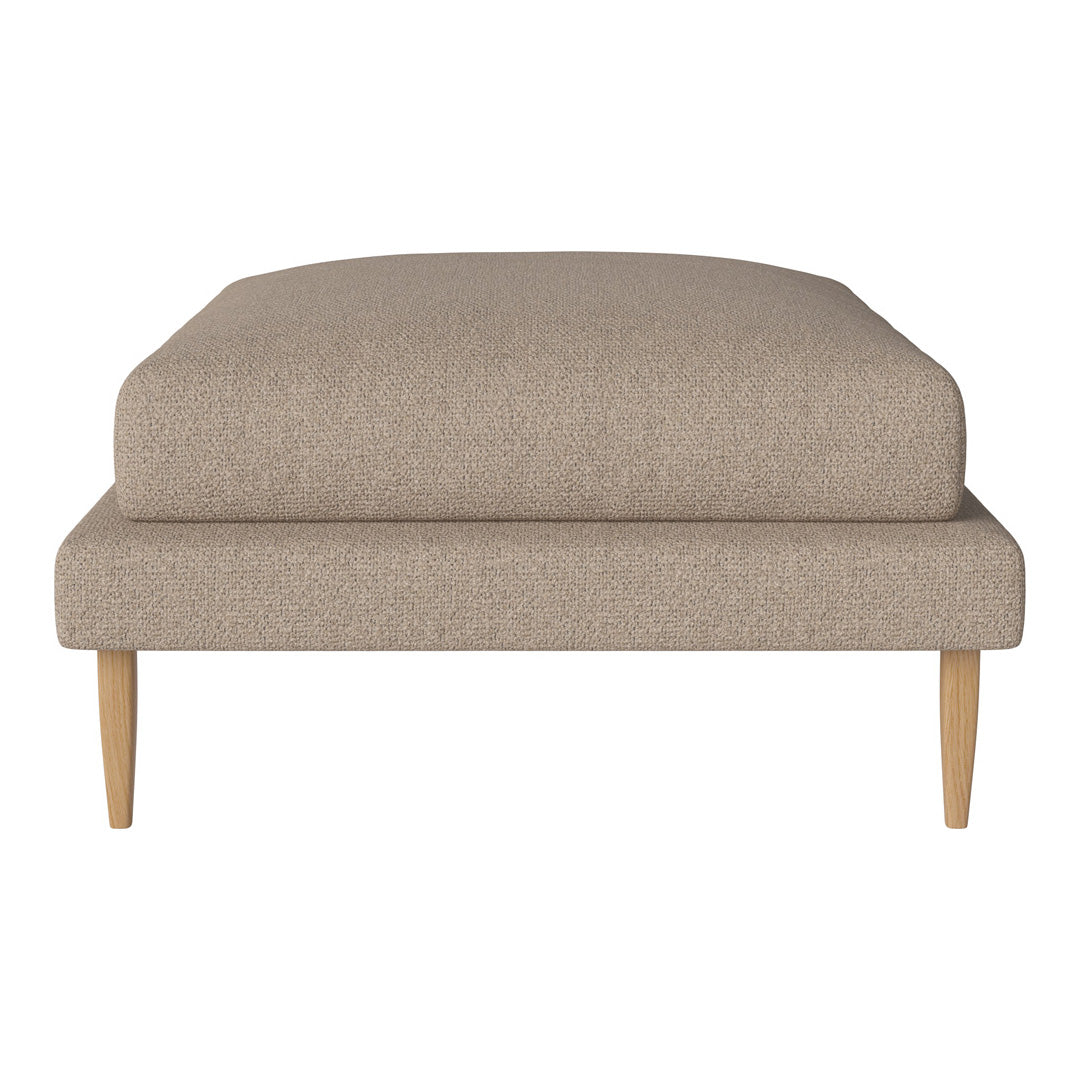Neutral beige ottoman featuring a smooth fabric texture and sleek wooden legs, perfect for modern decor.