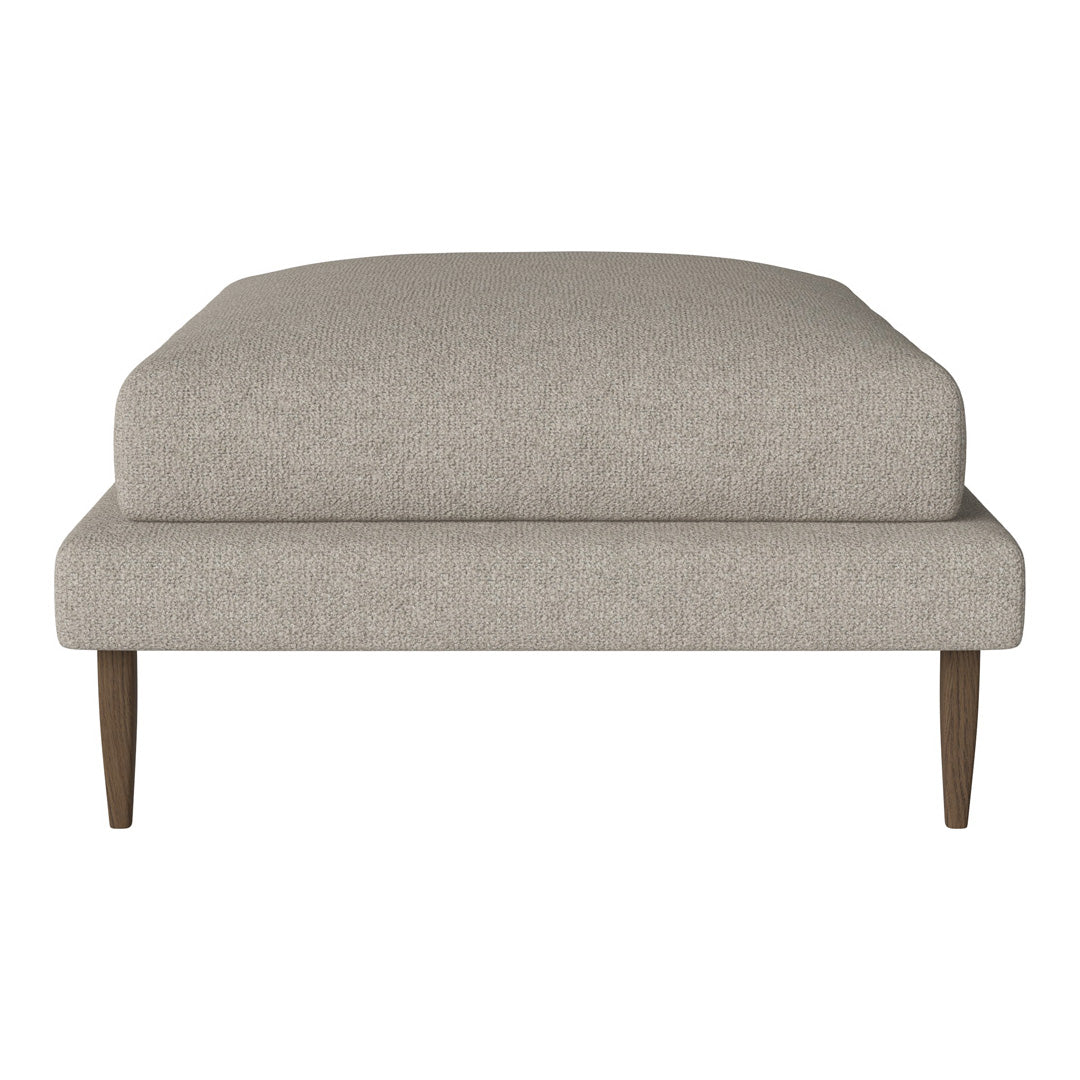 Beige upholstered ottoman with a smooth texture and wooden legs, perfect for modern or minimalist decor.