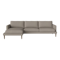 Light gray sectional sofa with clean lines and solid fabric, featuring a minimalist design and subtle texture.