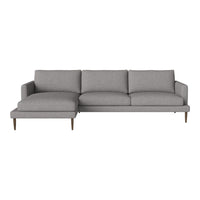 Gray sectional sofa with a clean, modern design and smooth fabric texture. Features minimalistic, light wooden legs.