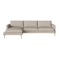Beige sectional sofa with a smooth texture and clean lines, featuring minimalistic design and silver legs.