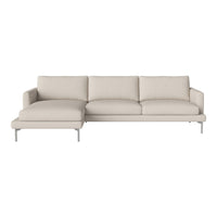 Beige sectional sofa with smooth fabric and minimalist design, featuring clean lines and light-toned cushions.