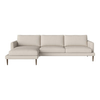 Light beige sectional sofa with clean lines and subtle texture, featuring a modern design and wooden legs.