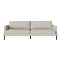 Light beige sofa with a simple, minimalist design and smooth upholstery, featuring no distinct patterns.