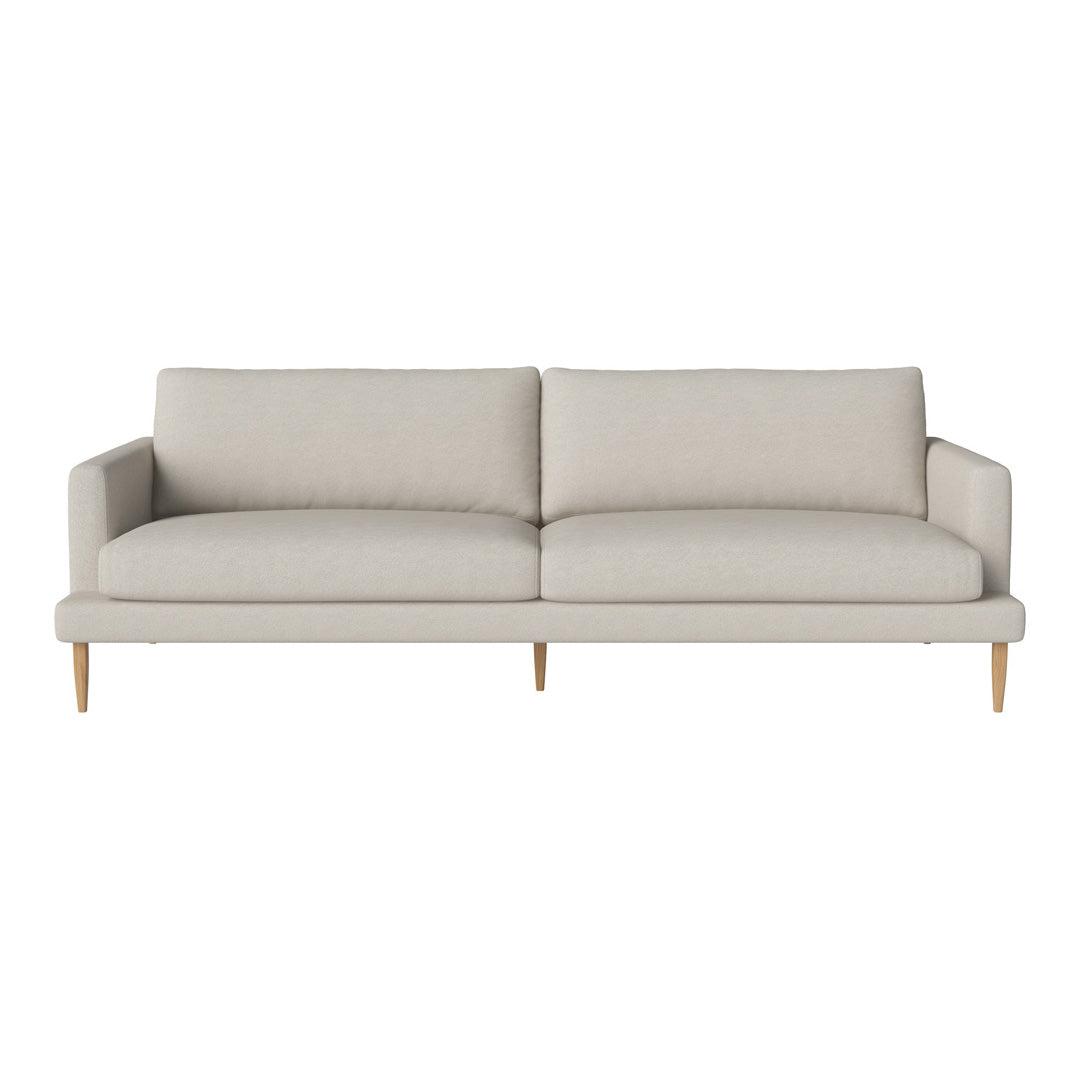 Neutral beige sofa with a minimalist design, featuring smooth upholstery and light wooden legs.