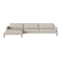 Light beige sectional sofa with smooth, modern upholstery and minimalist design, featuring natural wood legs.