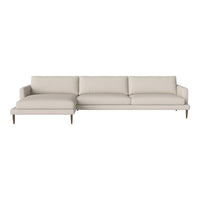 Light beige sectional sofa with smooth upholstery and minimalist design, featuring straight lines and no patterns.