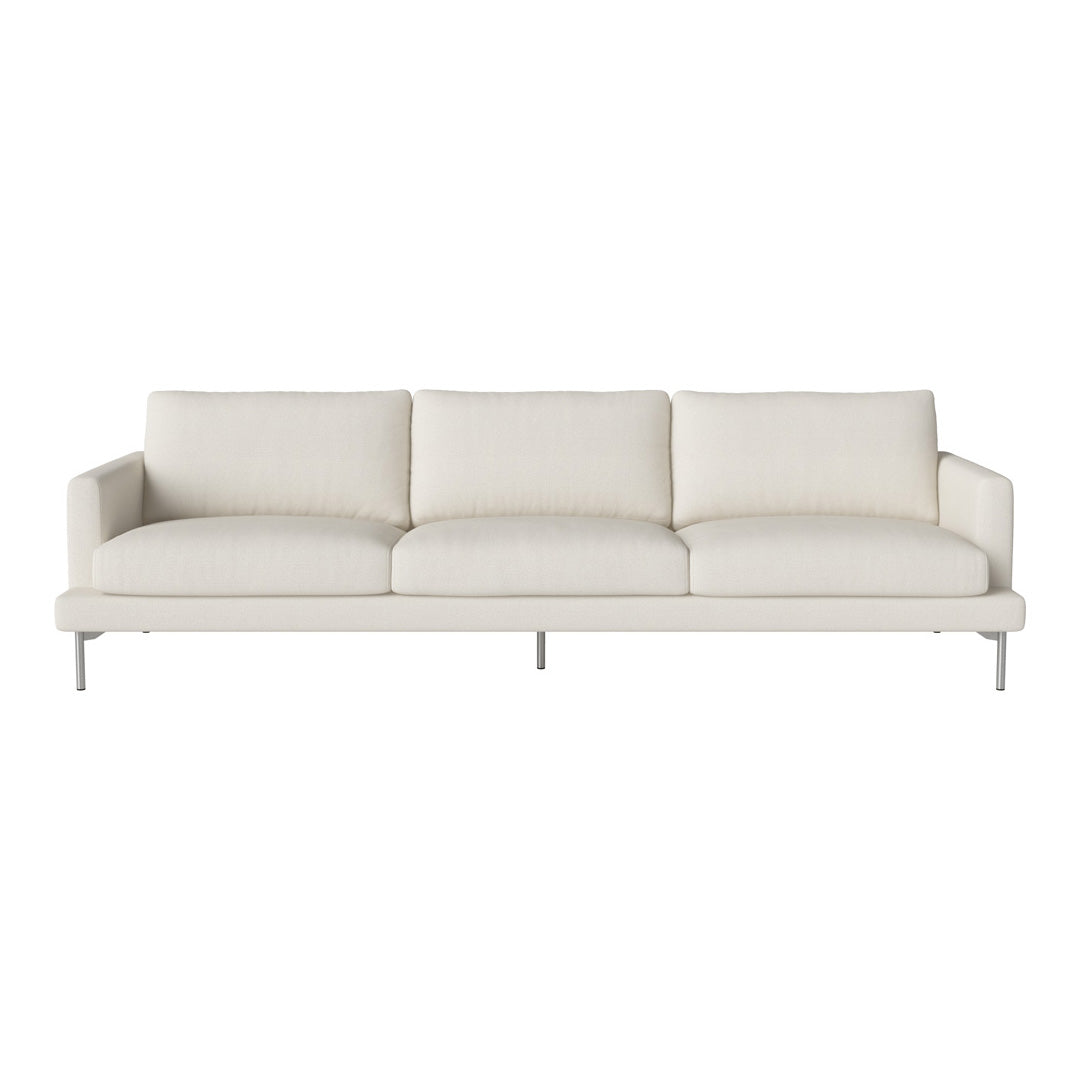 Neutral-colored sofa in soft cream fabric with a sleek, minimalistic design and brushed metal legs.