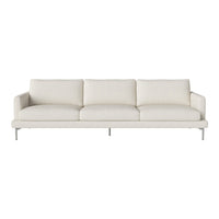 Neutral-colored sofa in soft cream fabric with a sleek, minimalistic design and brushed metal legs.