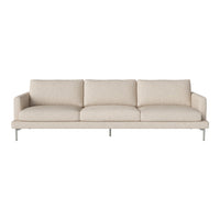 Beige upholstered sofa with a smooth texture and minimalist design, featuring three cushioned seats and sleek metal legs.