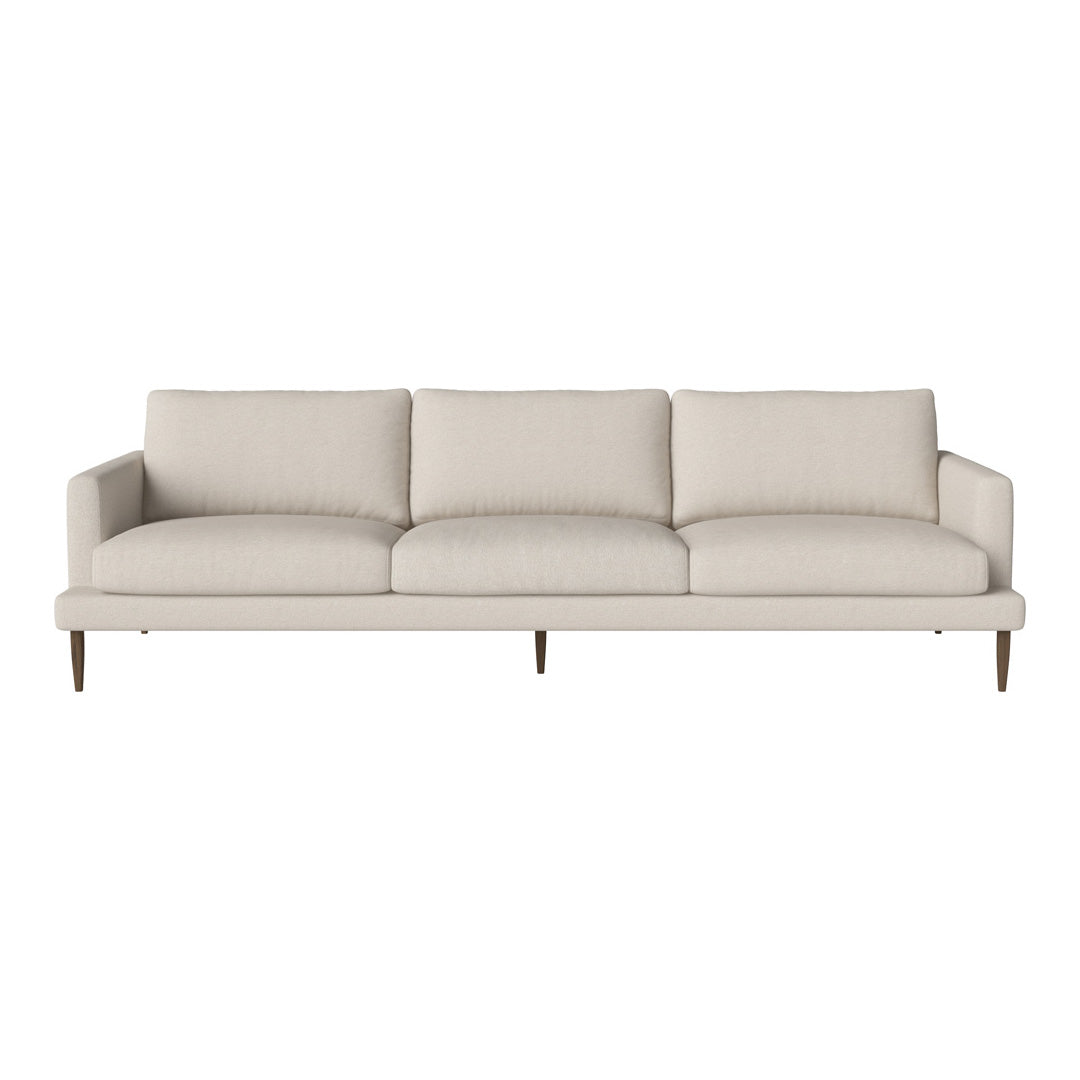Light beige mid-century modern sofa with simple lines and plush cushions, featuring wooden legs for a minimalist look.