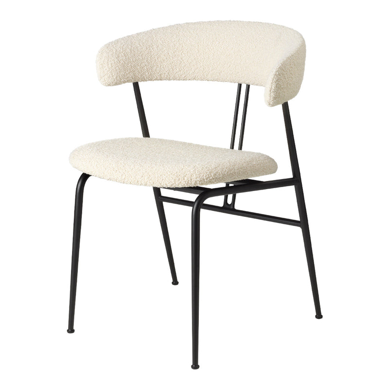 Cream upholstered chair with a curved backrest and black metal frame. Minimalist design with soft textures.