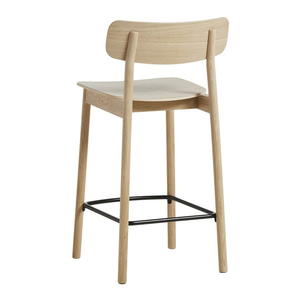 Natural wood finish with light beige tones and black metal footrest. Simple, modern design.