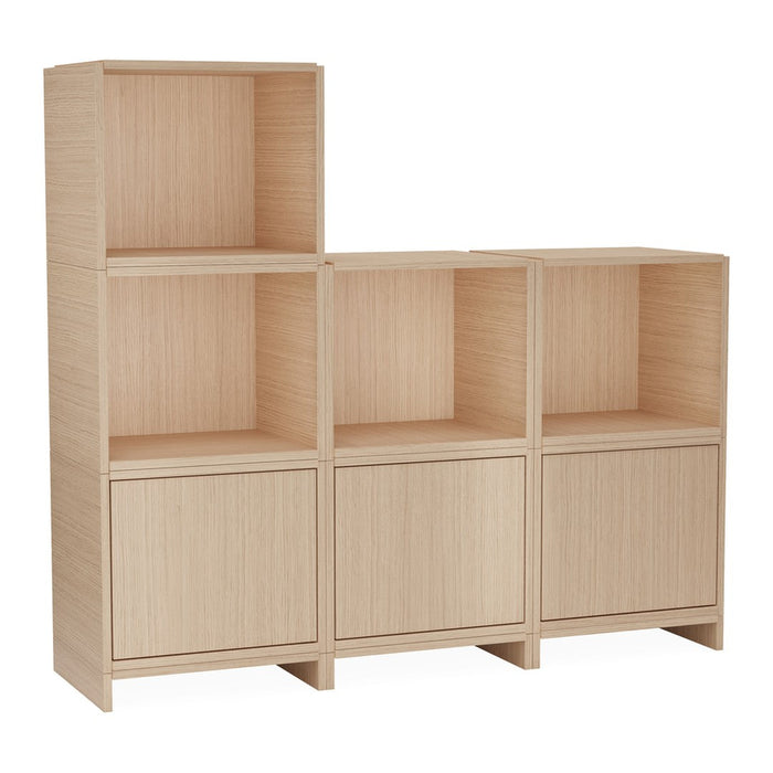 Light oak wood storage unit with open shelving and smooth, minimalist lines. Ideal for modern decor.