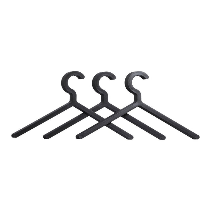 Set of three matte black hangers with a sleek, minimalist design, perfect for modern storage solutions.