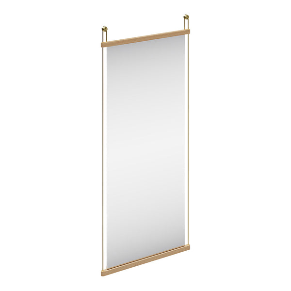 Minimalist vertical mirror with a natural wood frame and sleek gold accents, featuring a reflective surface.