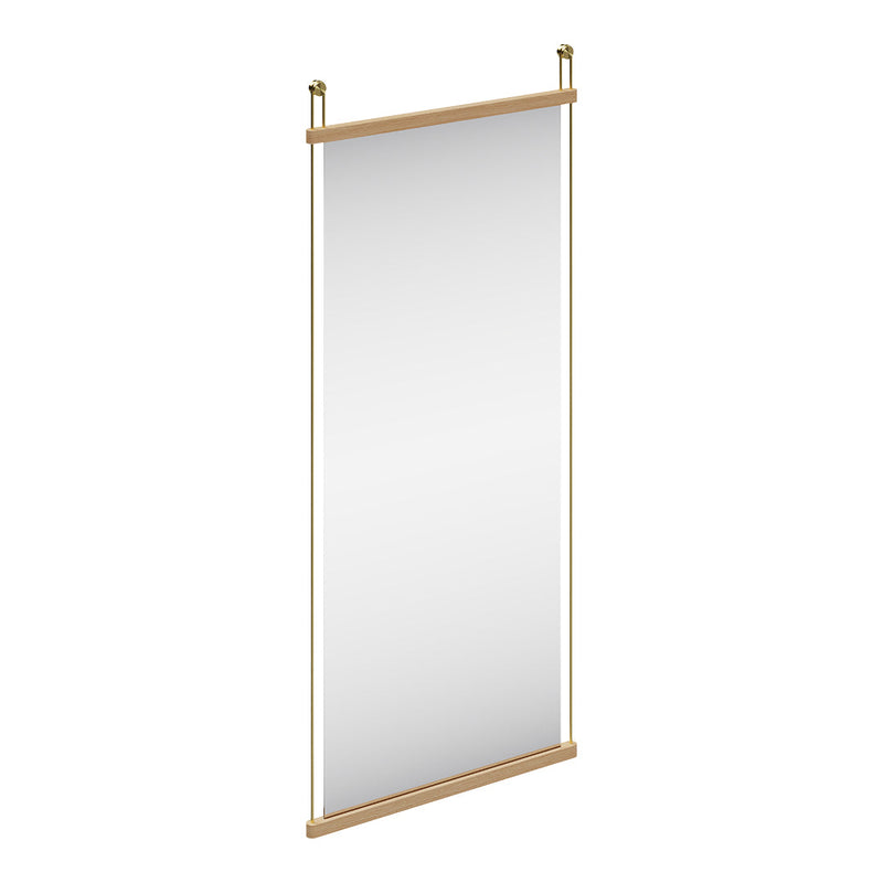 Minimalist vertical mirror with a natural wood frame and sleek gold accents, featuring a reflective surface.