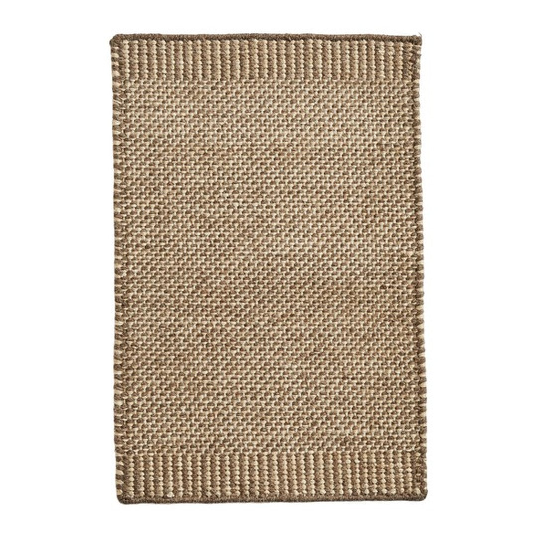 Natural woven jute rug in warm tan and brown tones with a textured, simple pattern. Perfect for rustic decor.