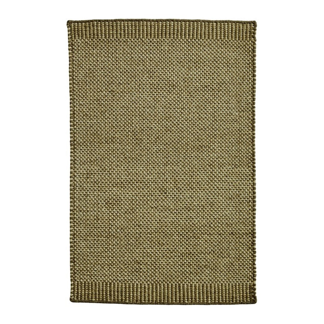 Natural green textured rug featuring a woven design, perfect for adding warmth to any space.