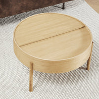 Round wooden coffee table with a light oak finish, featuring a smooth surface and minimalist design.