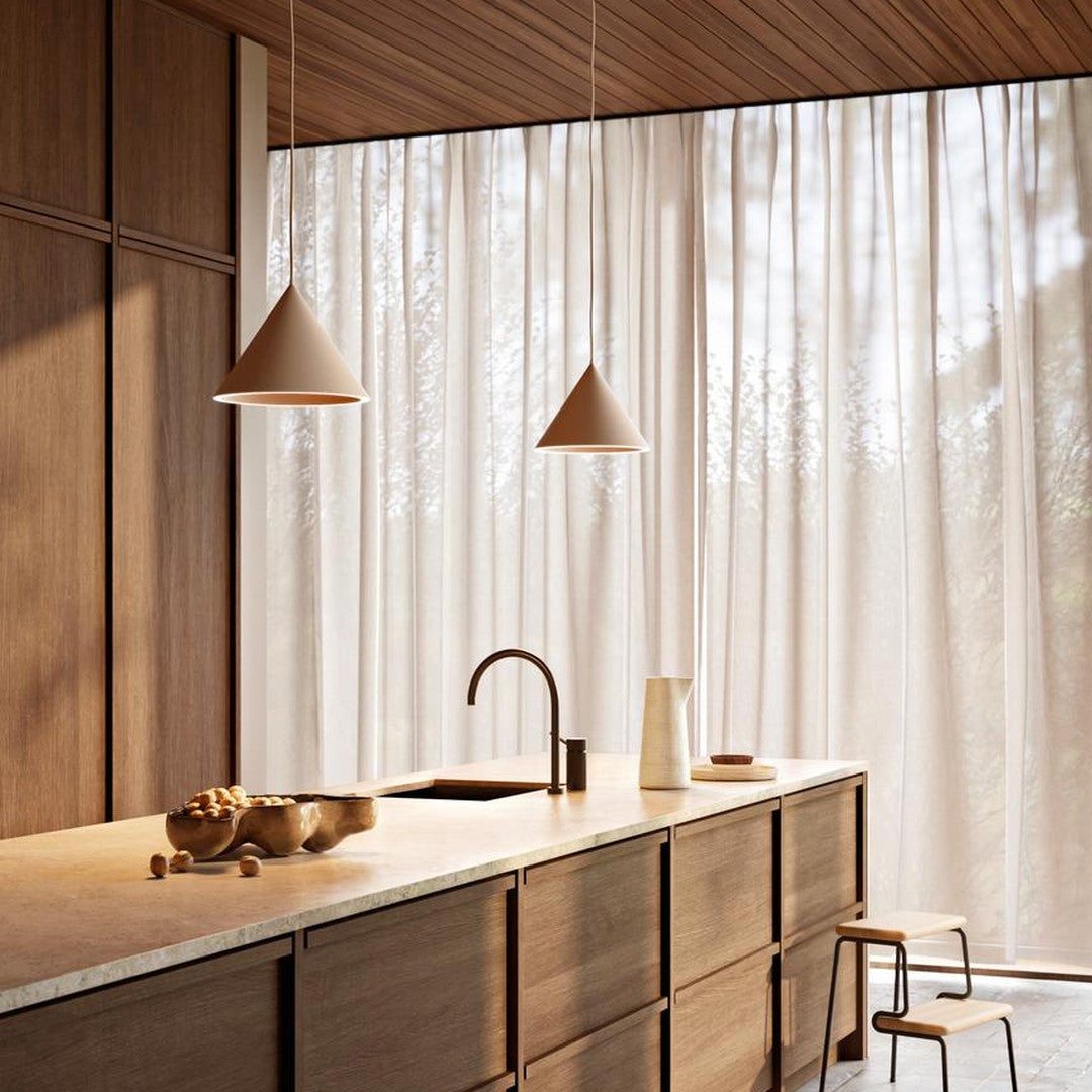 Elegant kitchen with warm wood tones, beige pendant lights, and light, airy white curtains. Modern, minimalist design.